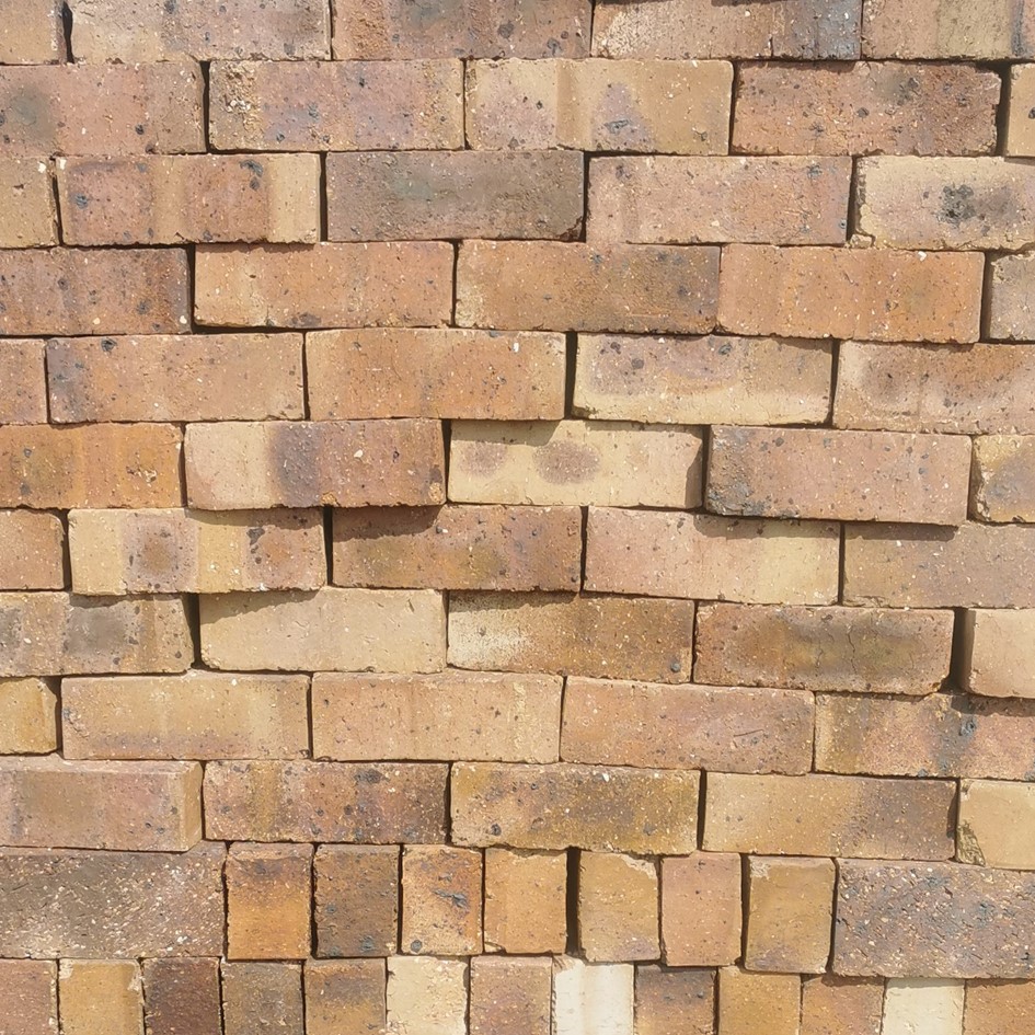 Garnett Satin Semi-Face Bricks featuring a vibrant blend of brown and yellow tones and a smooth, low-sheen satin finish.