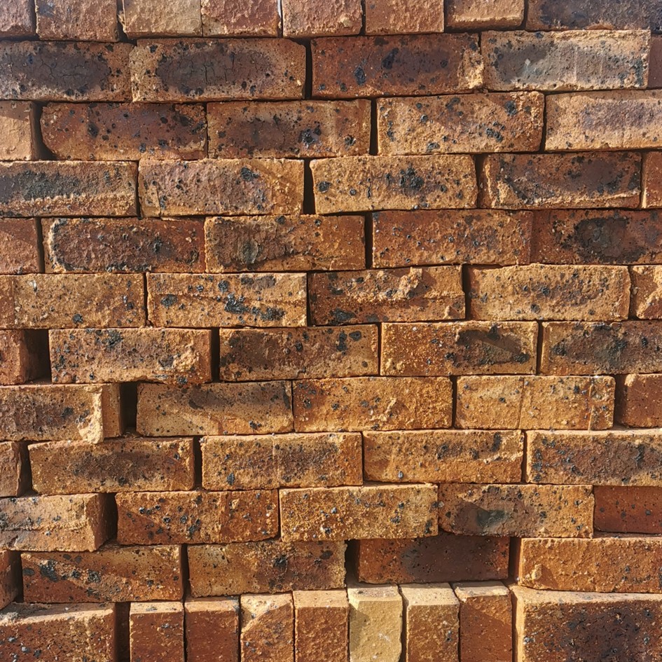 Roma Satin SemiFace Brick featuring deep brown and dark brown tones with a smooth satin finish for elegant garden walls and decorative facades.