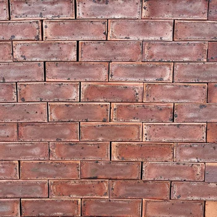 Mocha Satin Face Brick featuring a sophisticated blend of dark pink and red tones and a smooth, low-sheen satin finish.