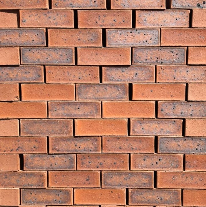 Festival Antique Satin Face Brick featuring a vibrant multi-toned red and orange color palette and a smooth, low-sheen satin finish.