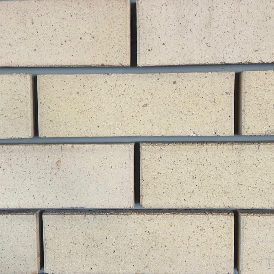 Ivory Satin Face Brick featuring a soft ivory tone and a smooth satin finish for premium architectural facades.