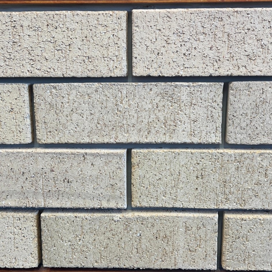 Ivory Travertine Face Brick featuring a soft ivory tone and a refined natural texture for premium architectural facades.