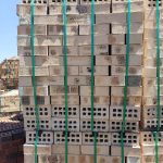 Fynbos Geel Satin Face Brick featuring light yellow tones with dark orange burns and a smooth satin texture for high-quality residential, commercial, and industrial building projects.
