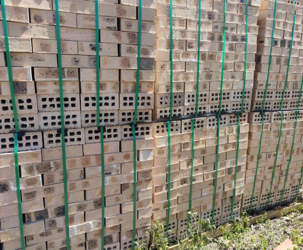 Fynbos Geel Satin Face Brick featuring light yellow tones with dark orange burns and a smooth satin texture for high-quality residential, commercial, and industrial building projects.