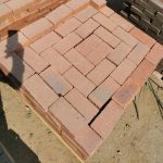 IronStone Variation Straight Edge Paver featuring deep burgundy red tones with a unique blue-burnt flash and crisp, straight edges for a smooth, interlocking paved surface.