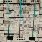Kiaat Travertine Facebrick featuring a light brown color profile with natural textured burns and a rugged travertine finish for premium commercial and agricultural buildings.