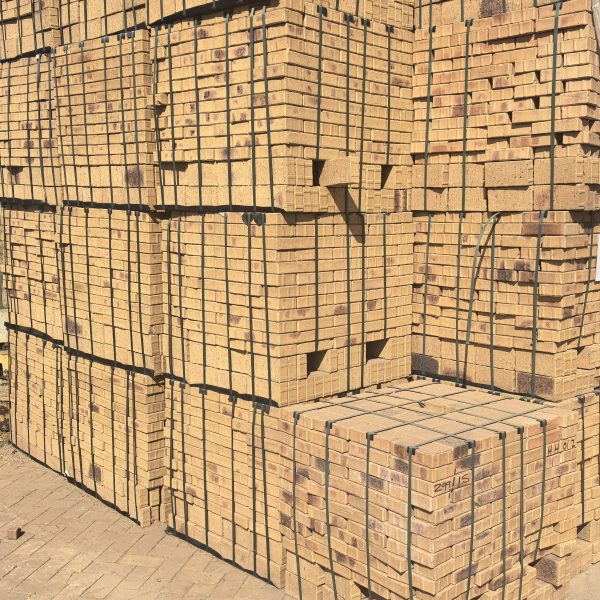 Namaqua Stone Bevel Paver featuring mid-brown tones with characteristic black spots and a precise 50mm chamfered edge for residential and commercial paving.