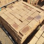 Namaqua Stone Variation Straight Edge Paver featuring vibrant yellow tones with a unique blue-burnt flash and a flush 50mm straight-edge finish for modern paving projects.