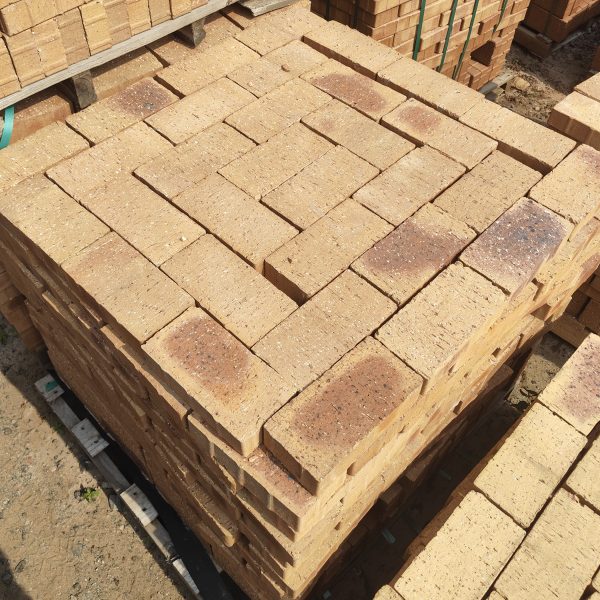 Namaqua Stone Variation Straight Edge Paver featuring vibrant yellow tones with a unique blue-burnt flash and a flush 50mm straight-edge finish for modern paving projects.
