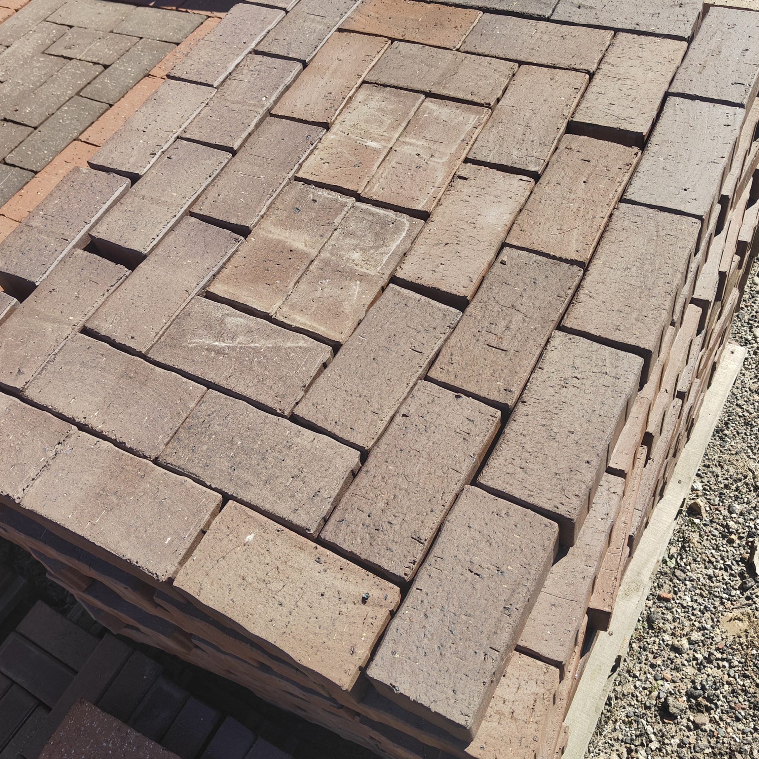 Nutmeg 65mm Bevel Paver featuring a robust dark brown clay profile and a thick chamfered edge for heavy-duty driveways and commercial paving projects.