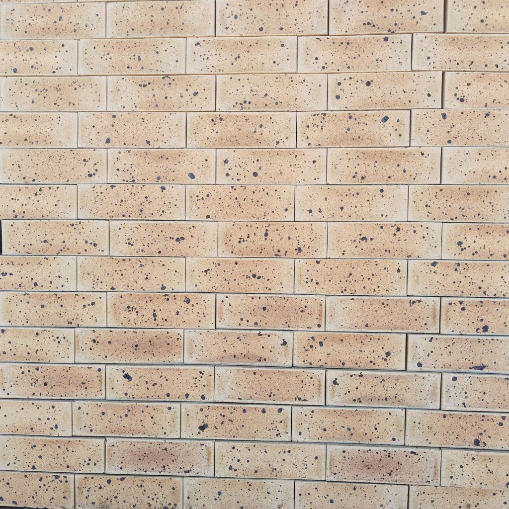Topaz Satin Facebrick featuring an elegant light brown color profile and a smooth satin texture for premium residential, commercial, and industrial building facades.