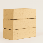 Studio shot of three stacked Ivory Satin face bricks showing clean edges, smooth face finish, and light cream clay hue.