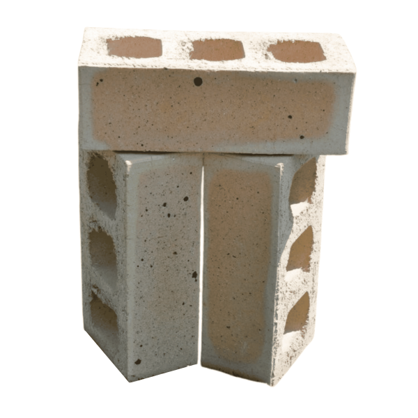 Studio shot of three Marble Satin clay face bricks arranged vertically showcasing three core perforations, smooth satin texture, and subtle peach-tan centers.