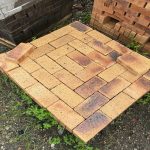 Namaqua Stone Variation Straight Edge Paver featuring vibrant orange clay tones with dark blue burns and a uniform profile for smooth driveways and walkways.