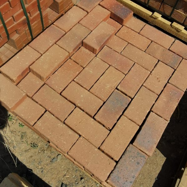 Mid Red Tuscan Blend Clay Bevel Paver featuring uniform sizing with subtle reddish color variations for light to medium traffic residential and commercial paving.
